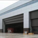 Vertical Lift Steel 3-Leaf multiple Doors 80' x 28' for High Wind Load and Post Disaster Operation