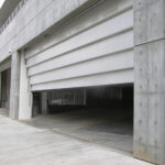 Vertical Lift Steel 6-Leaf 40' x 14' Doors with sloped grade across opening