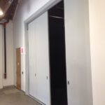 Fold Acoustic Door at a design studio, center panels fold and swing 180 for a full width opening