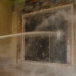 Slide Fire Door with Wicket Door, during hose stream test