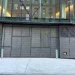 27' x 15' 6-panel folding doors clad to match adjacent ornamental grilles - NYU 181 Mercer, NY
