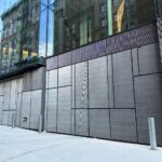 27' x 15' 6-panel folding doors clad to match adjacent ornamental grilles - NYU 181 Mercer, NY